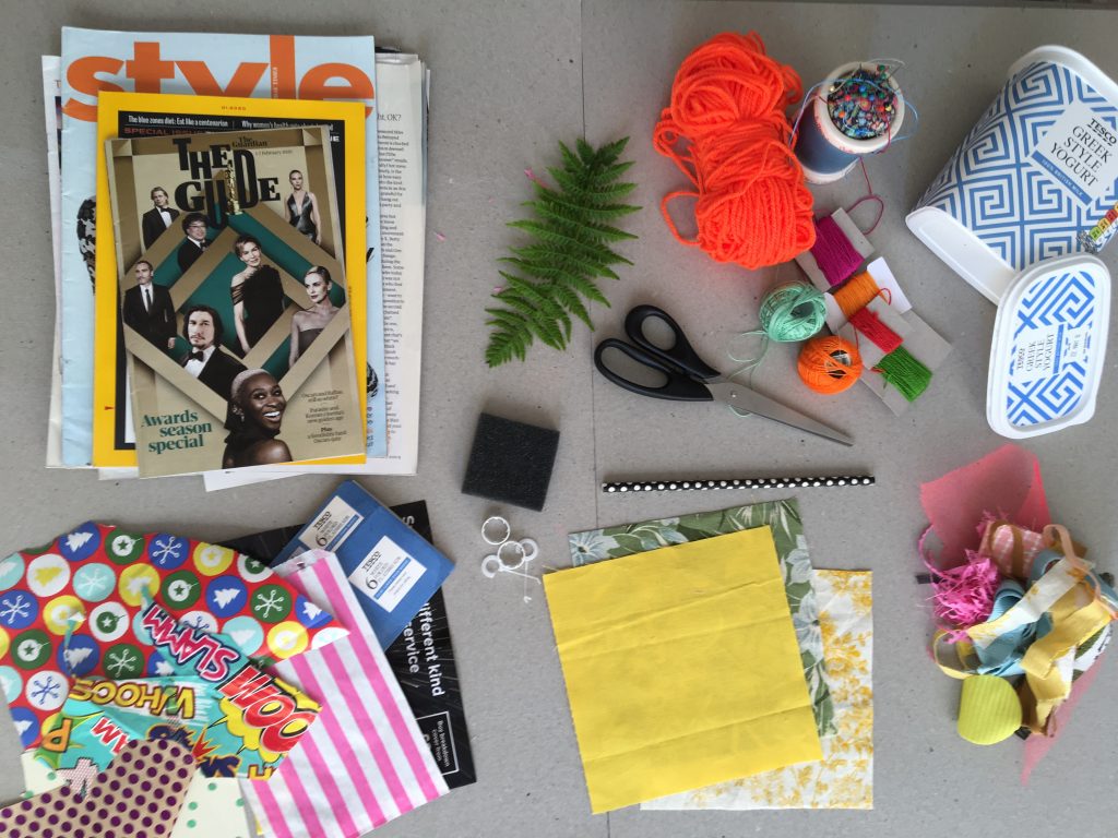 Scissors, paper, and craft materials on a table