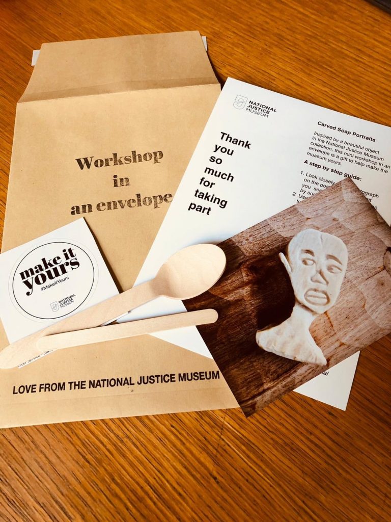 Paper, a spoon, and instructions for 'Workshop in an Envelope'